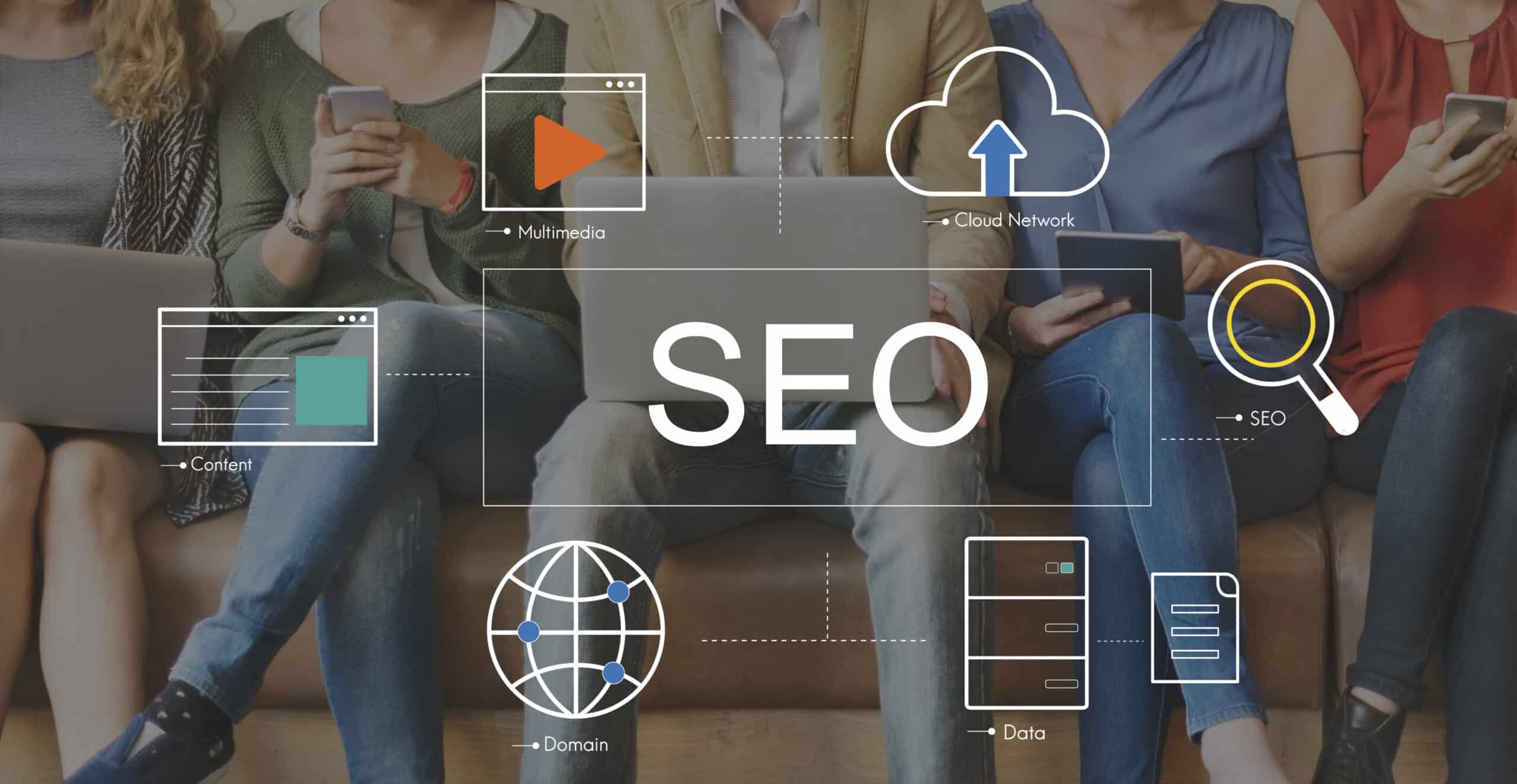 A group of people using laptops, tablets, and smartphones while SEO-related icons for content, multimedia, domain, cloud network, and data surround the word “SEO” in the centre, symbolising modern SEO strategies.